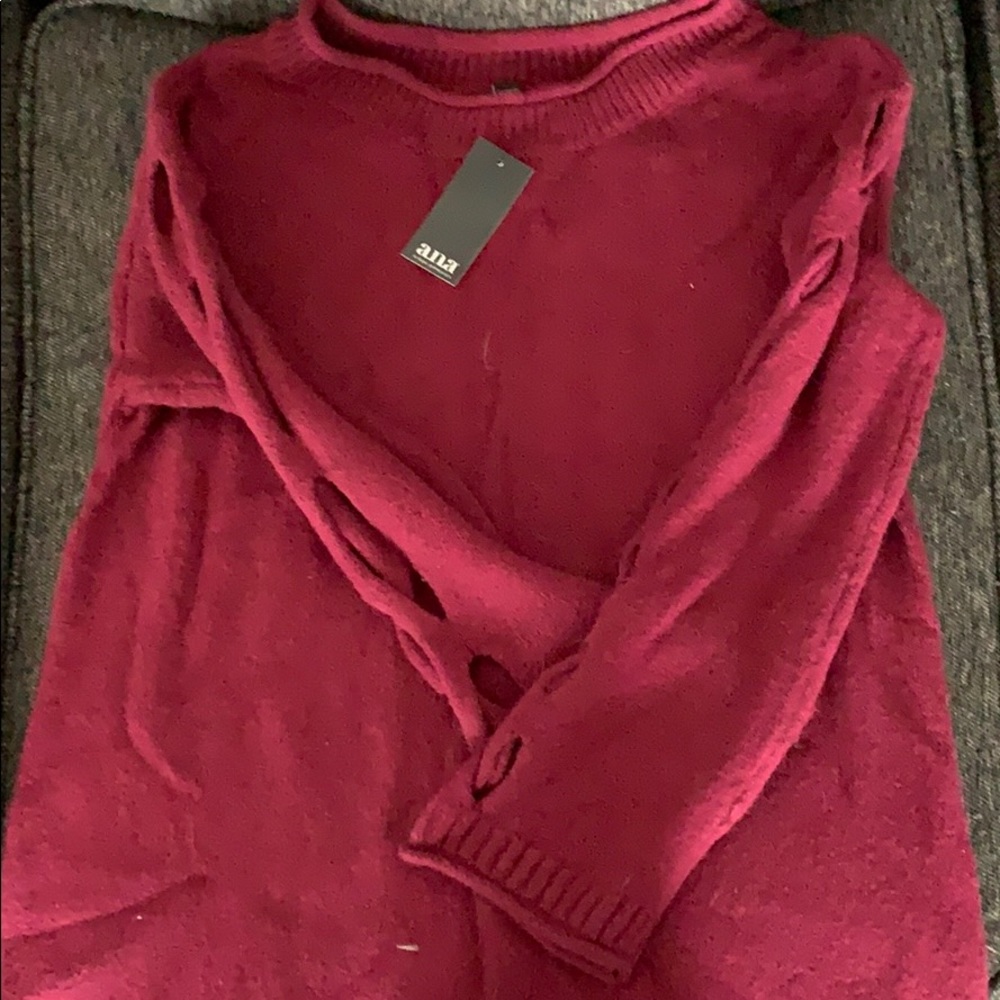 High neck sweater with cut outs in arms